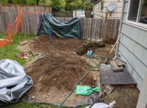 esidential-sewer-line-excavation-seattle-backyard.webp